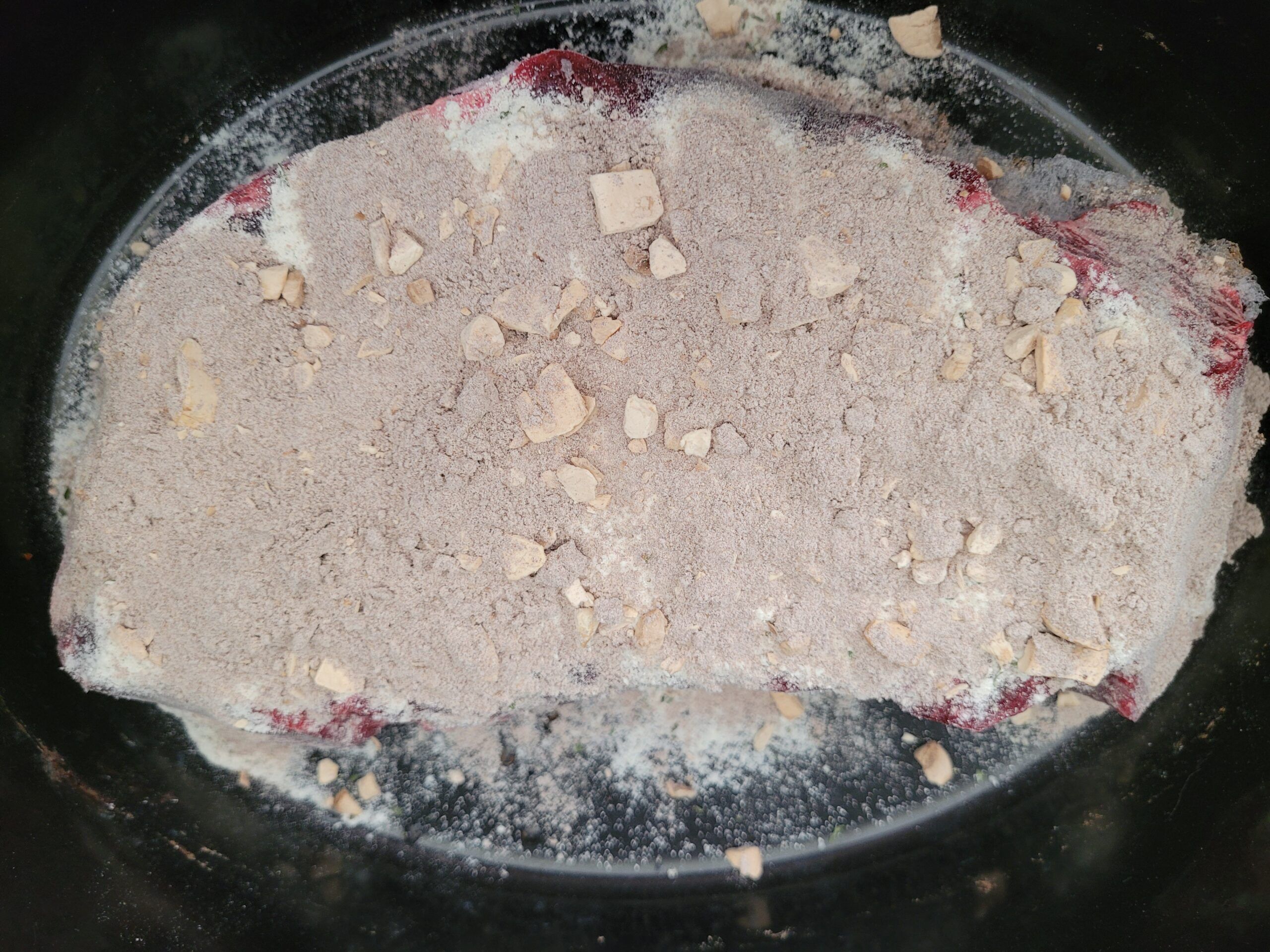 Sprinkle the ranch dressing and gravy over meat.