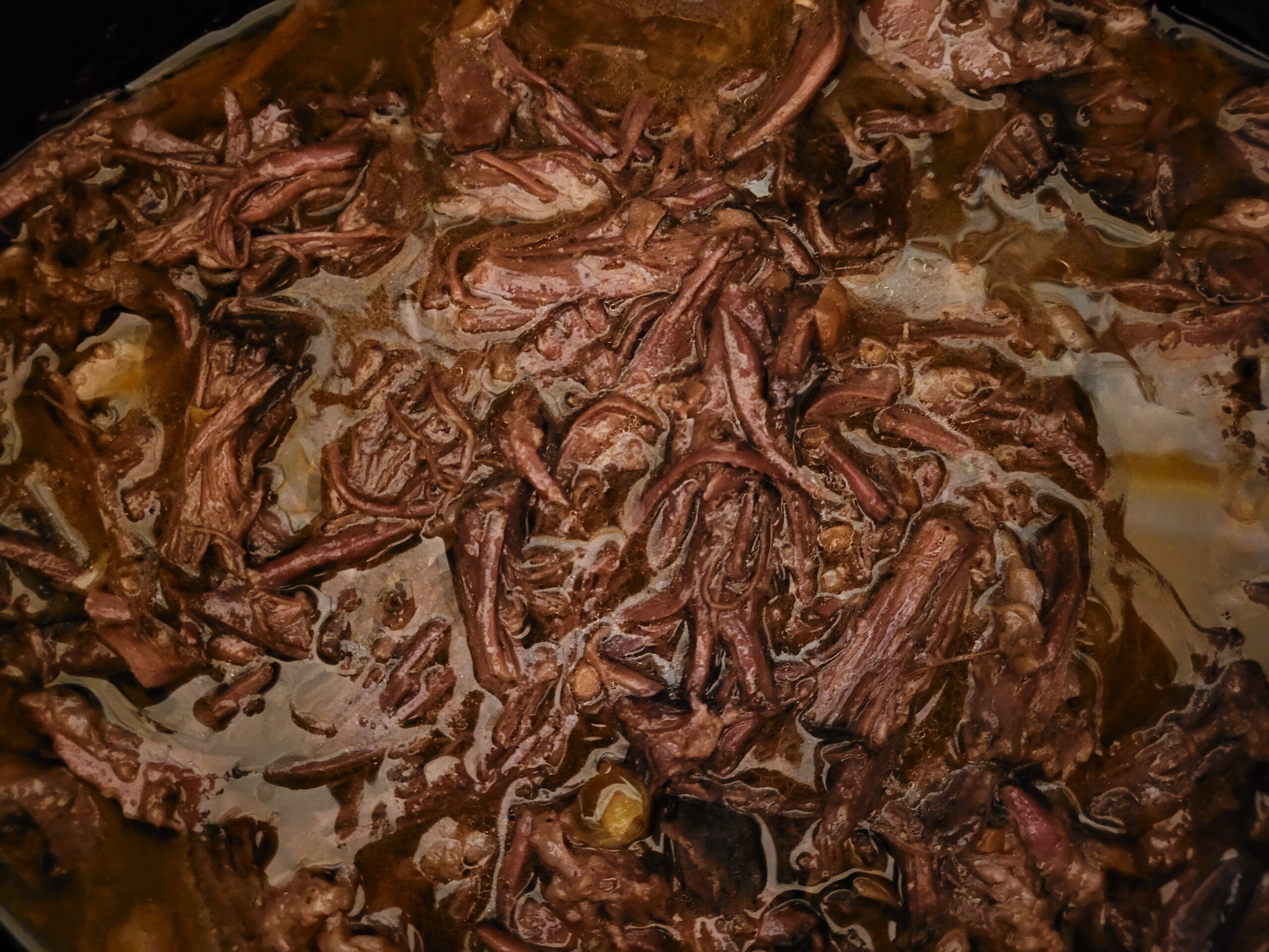 Shred meat with two forks.
