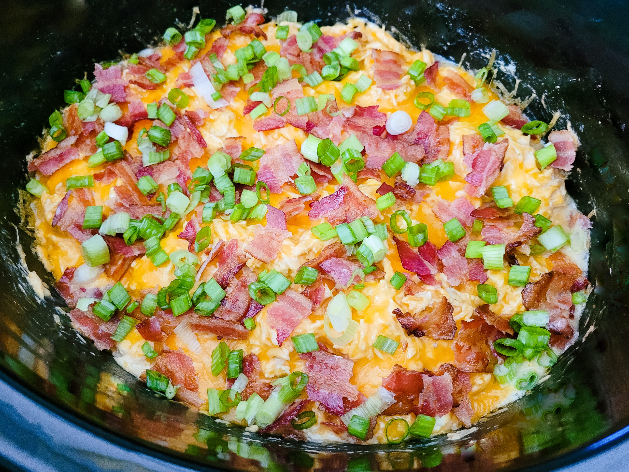 Add bacon and green onions. Serve hot.