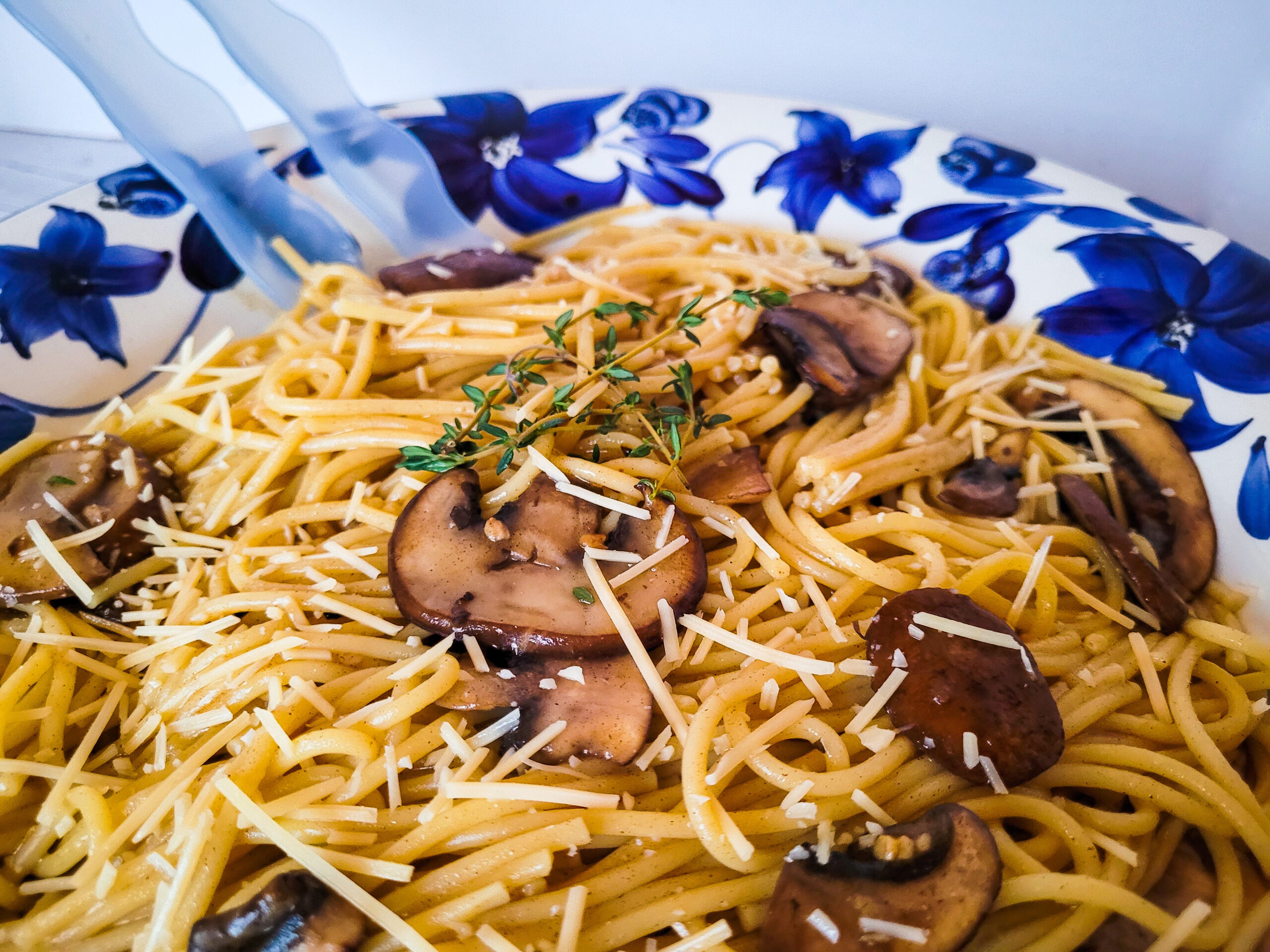 Spaghetti with Mushroom and Thyme Browned Butter Sauce Garnish with shredded parmesan and thyme sprigs.