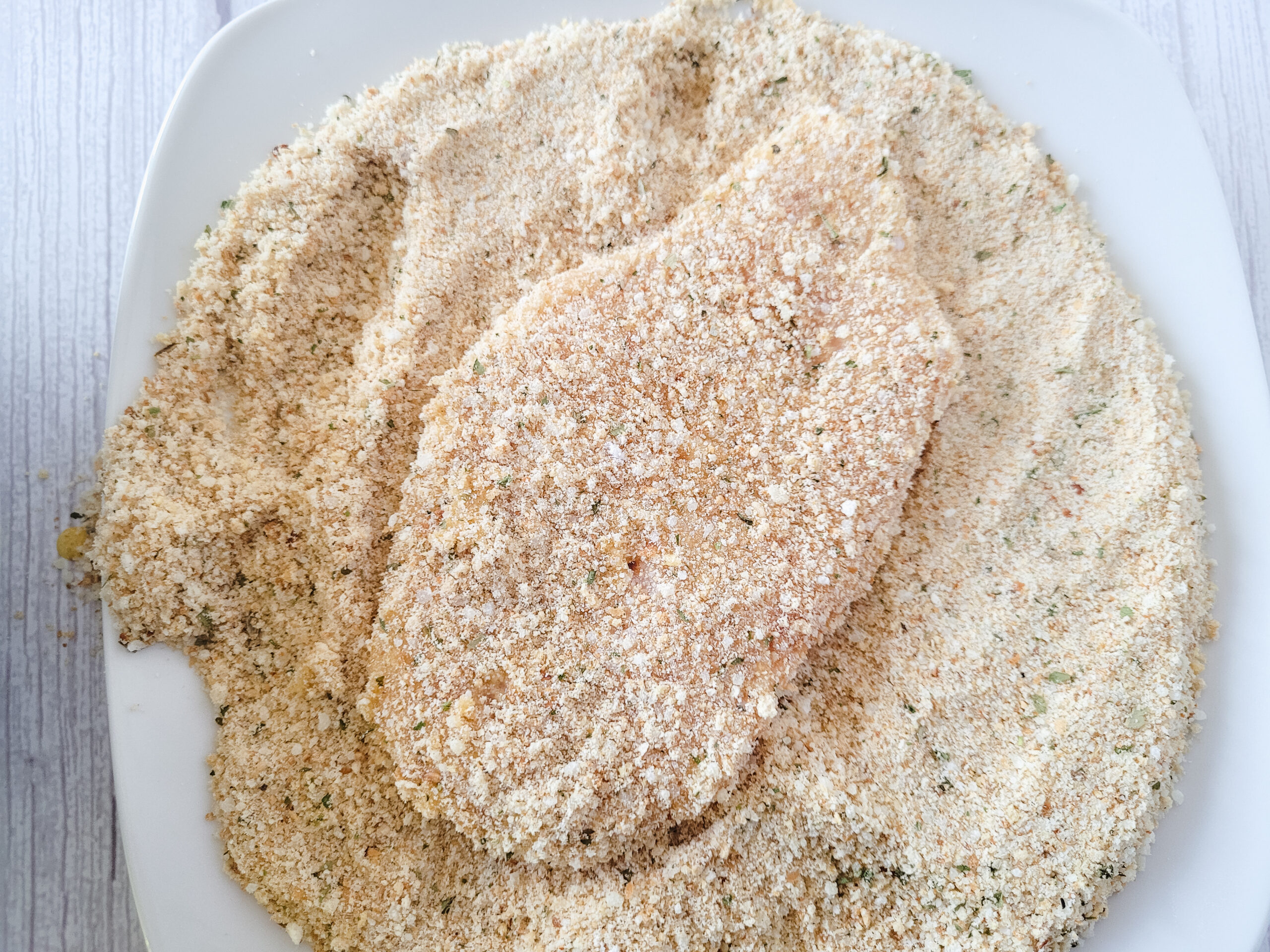 Breading Chicken Breasts Coat breasts in breadcrumb mixture, pressing gently.