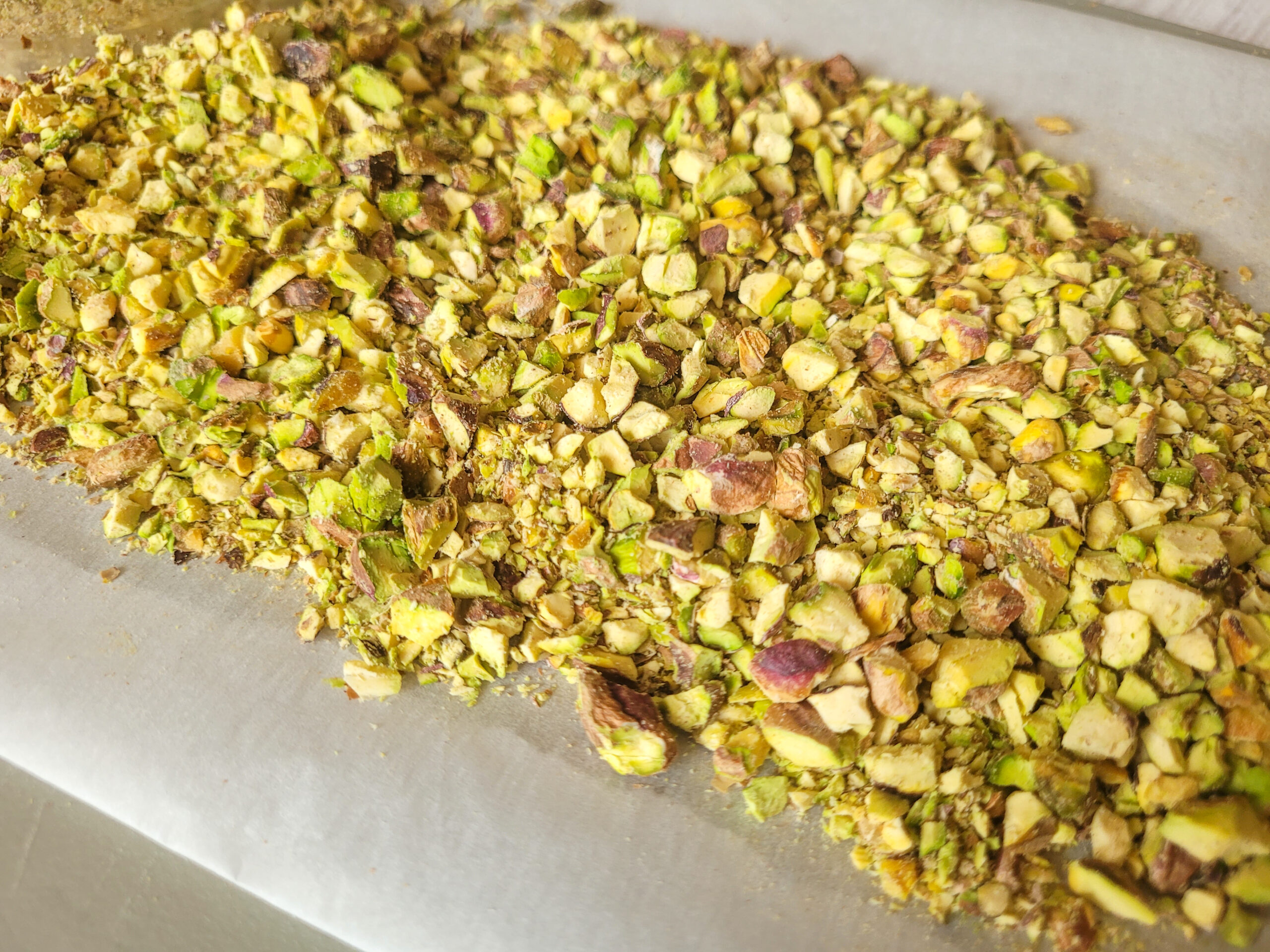 Chopped Pistachios Chop raw pistachios and lay on a parchment paper-covered baking sheet.