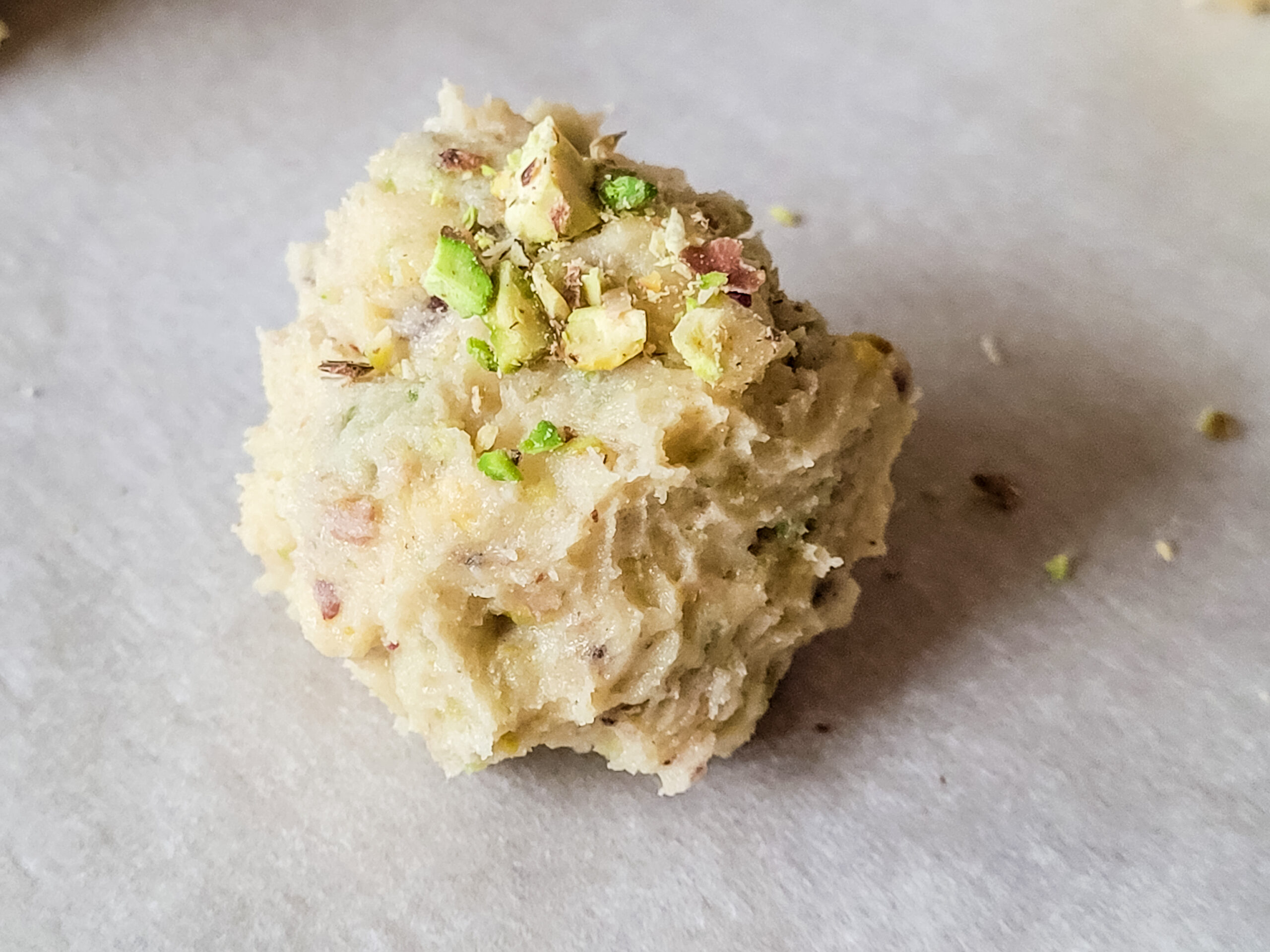 Making Italian Pistachio Cookies Form tablespoons of dough into balls; place on parchment-covered baking sheet.