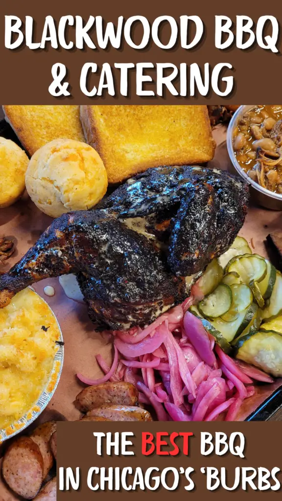 A spread of barbequed foods stretches across the pin, including blackened chicken, a corn muffin, two slices of Texas toast, mac and cheese, a pile of pickle slices. a pile of pickled red onion slices, sliced sausage, and a dish of pork and beans.